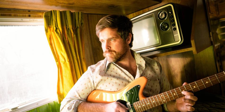 Jessie Blake Rundle Playing Guitar